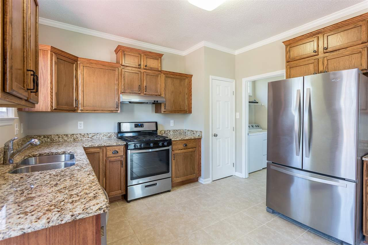 12000 North Exeter Way Raleigh, NC 27613 - Photo 14 of 29 Ceramic tiled floor in Kitchen