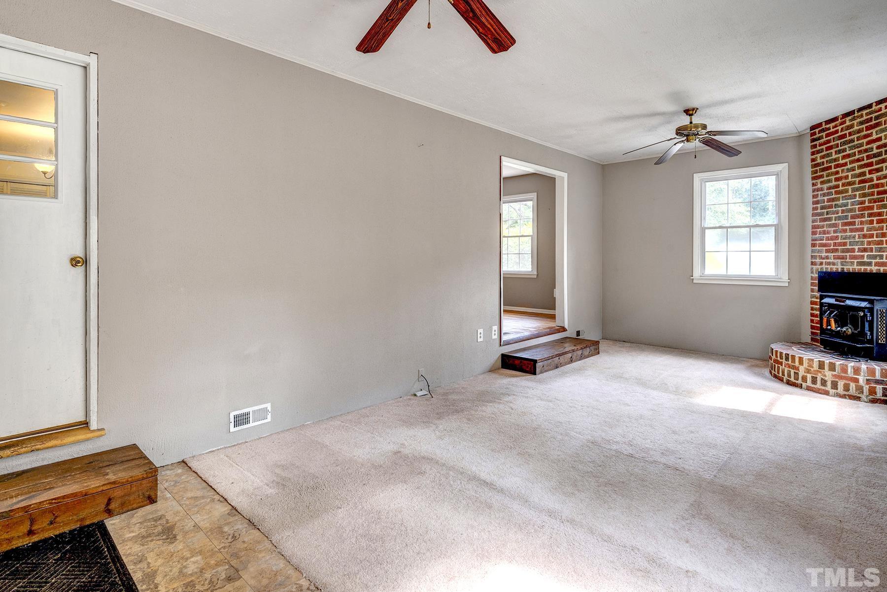 5816 Neuse Street Raleigh, NC 27610 - Photo 14 of 32 a view of an empty room with a window