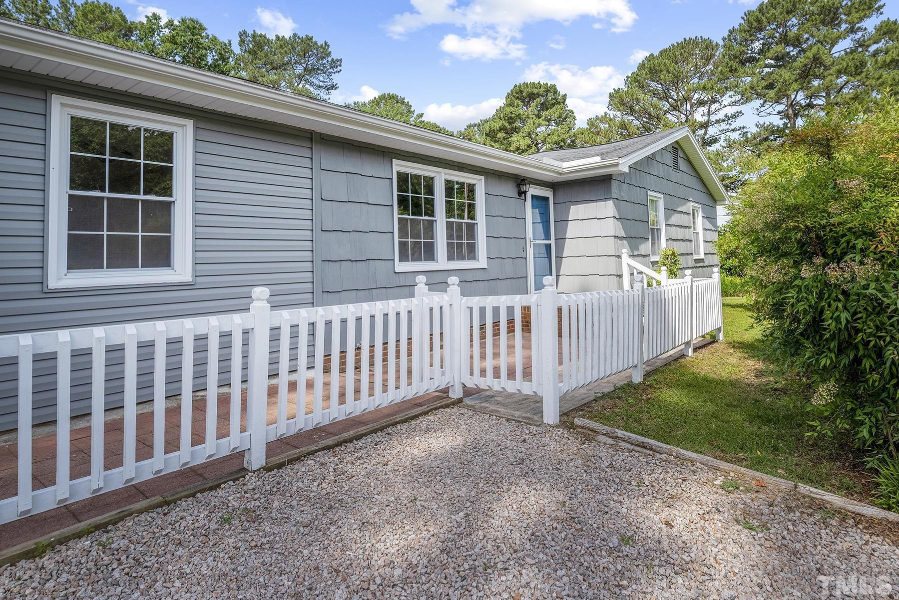 5816 Neuse Street Raleigh, NC 27610 - Photo 2 of 32 a front view of a house with balcony