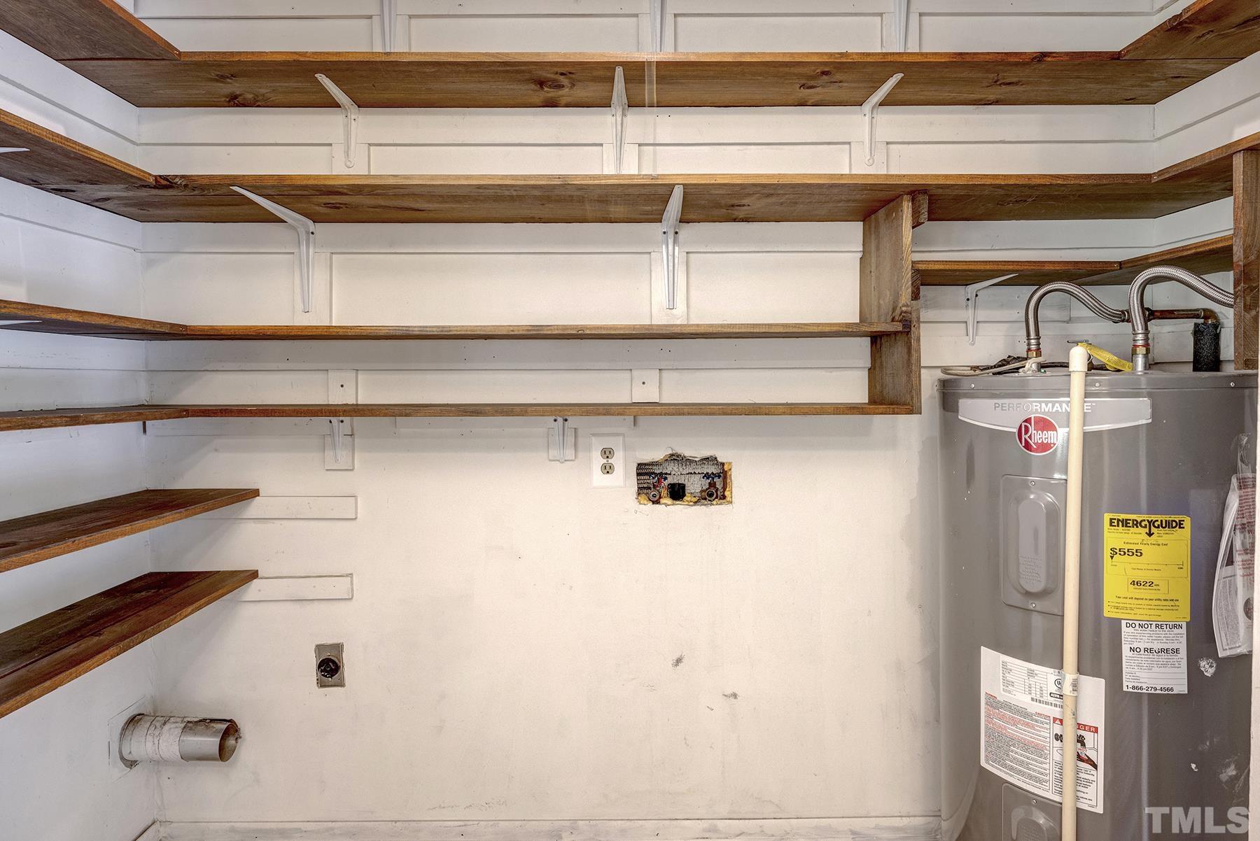 5816 Neuse Street Raleigh, NC 27610 - Photo 25 of 32 a view of storage and utility room with racks on the wall