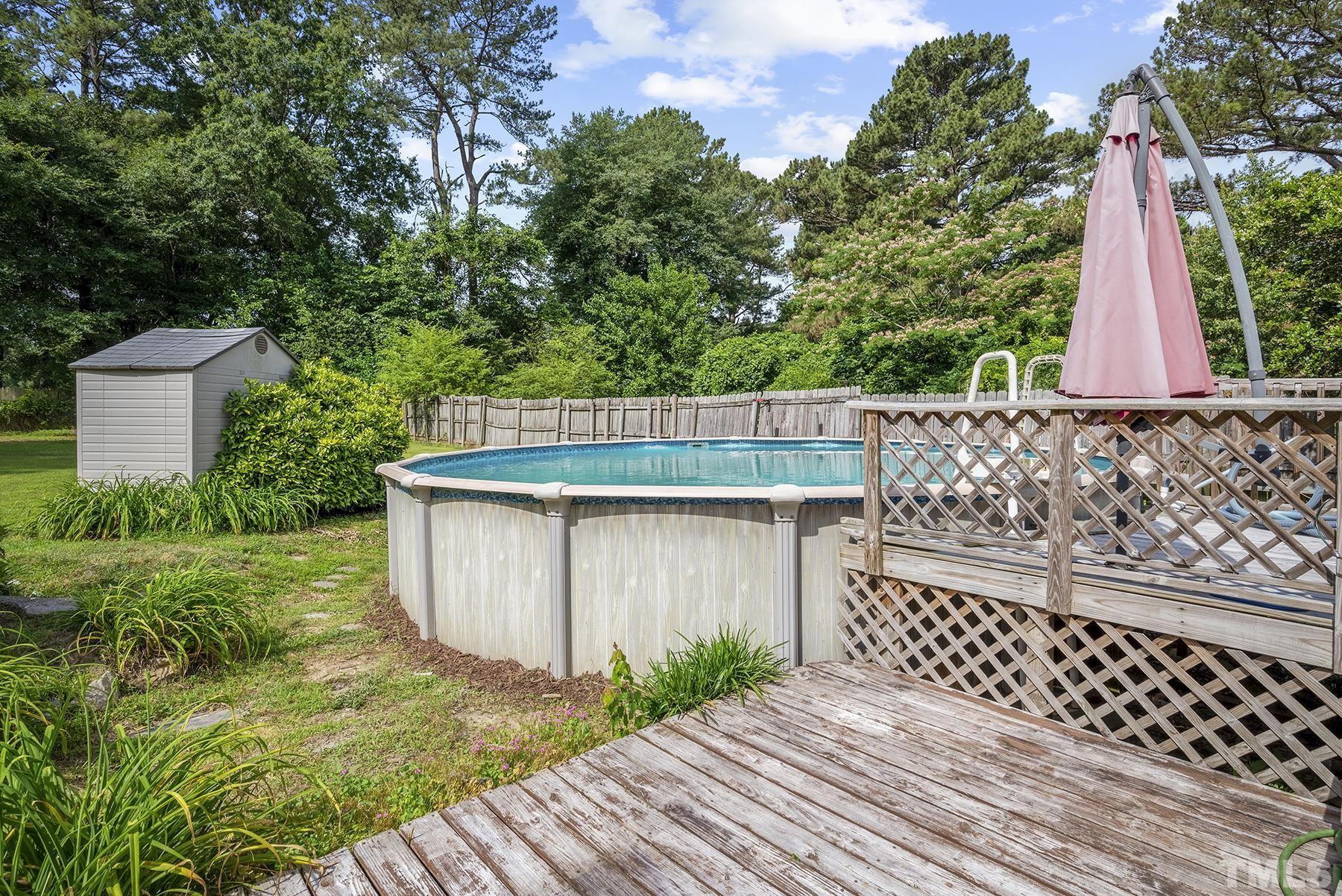 5816 Neuse Street Raleigh, NC 27610 - Photo 29 of 32 a view of a backyard with wooden fence