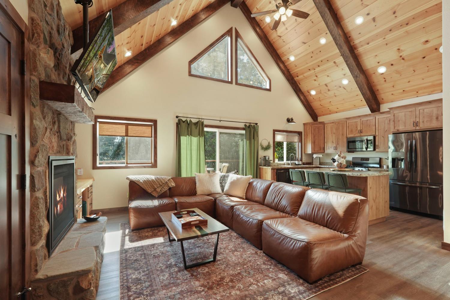 20819 Muheli Road Mi Wuk Village, CA 95346 - Photo 17 of 49 a view of living room kitchen and stainless steel appliances