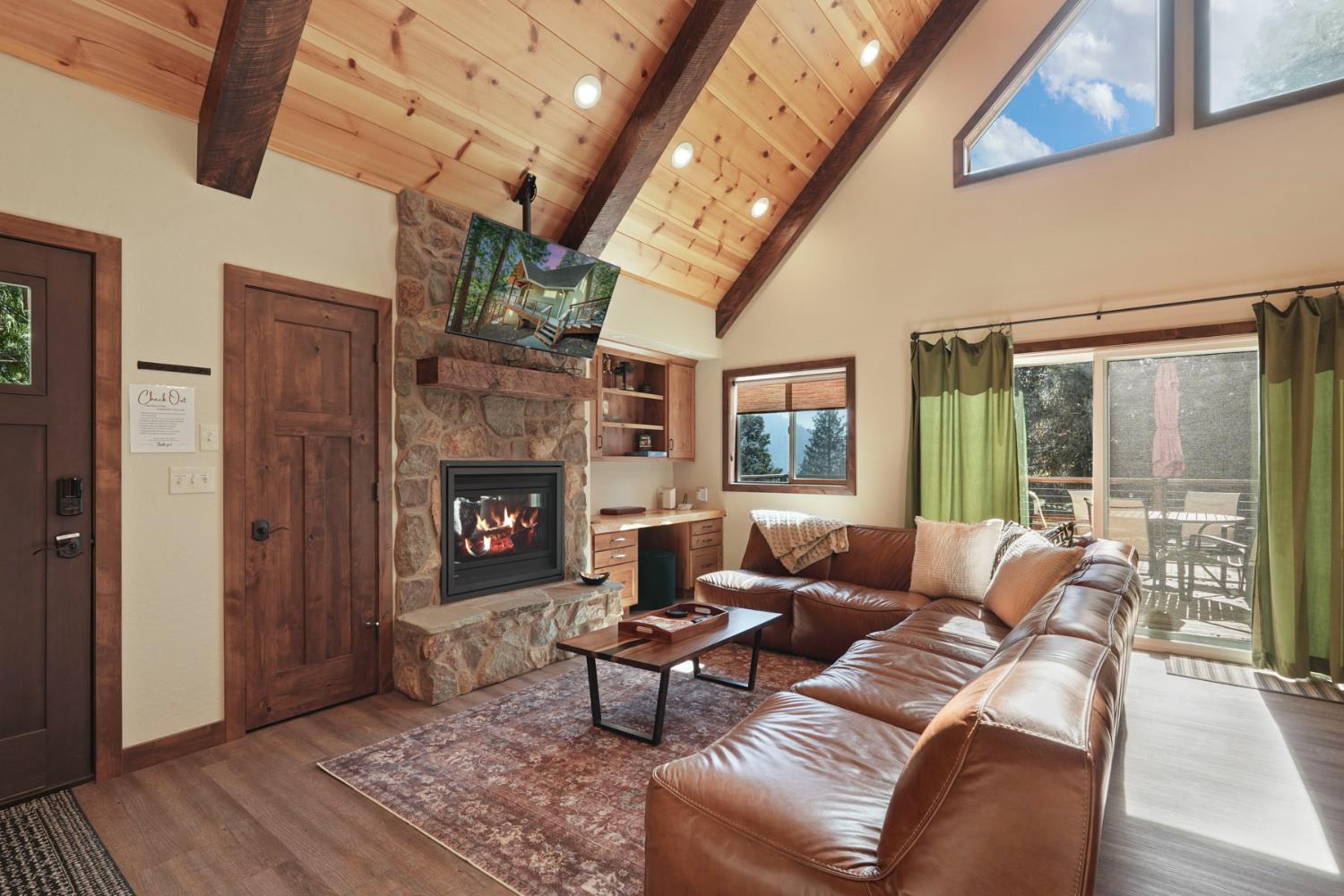 20819 Muheli Road Mi Wuk Village, CA 95346 - Photo 18 of 49 a living room with furniture and a fireplace