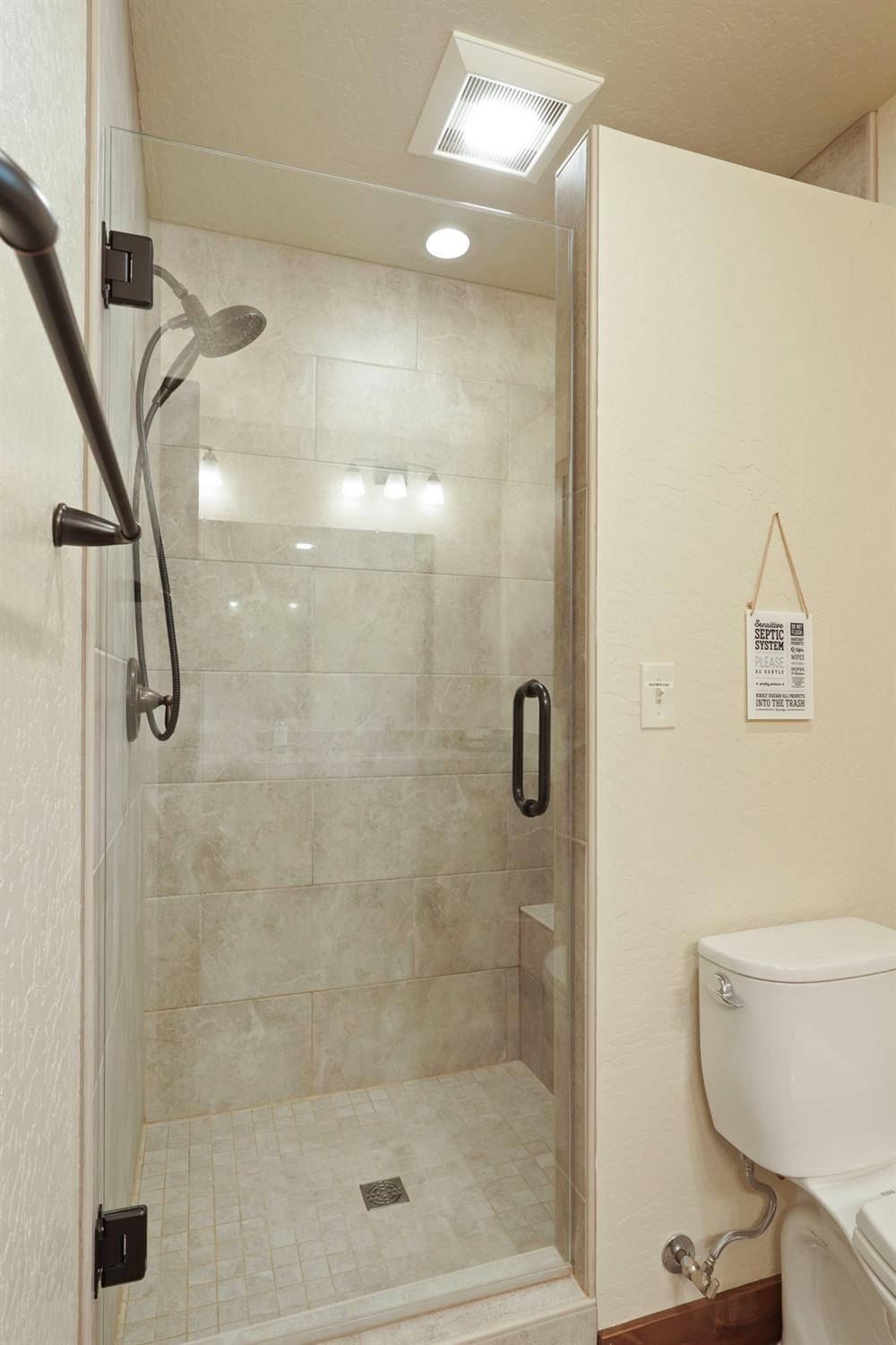 20819 Muheli Road Mi Wuk Village, CA 95346 - Photo 31 of 49 a bathroom with a shower and a toilet