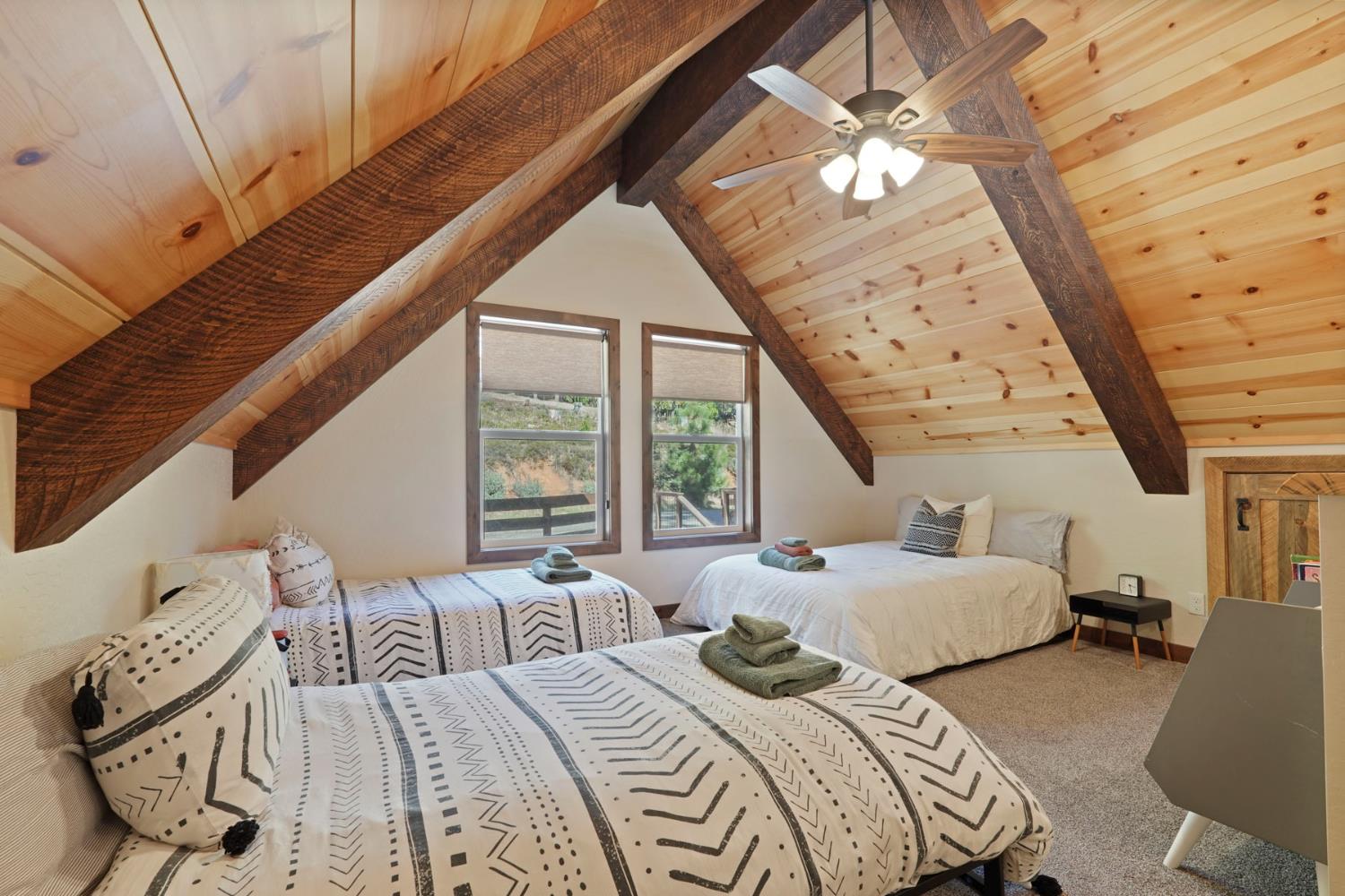 20819 Muheli Road Mi Wuk Village, CA 95346 - Photo 33 of 49 a bedroom with furniture and large windows