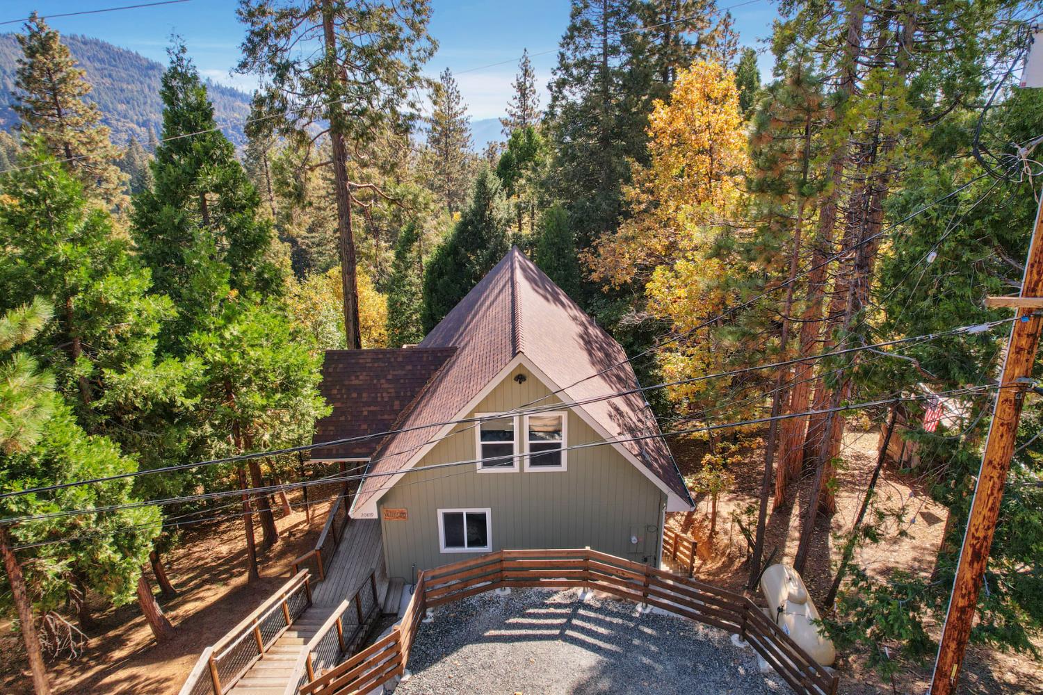 20819 Muheli Road Mi Wuk Village, CA 95346 - Photo 9 of 49 a view of a house with a yard