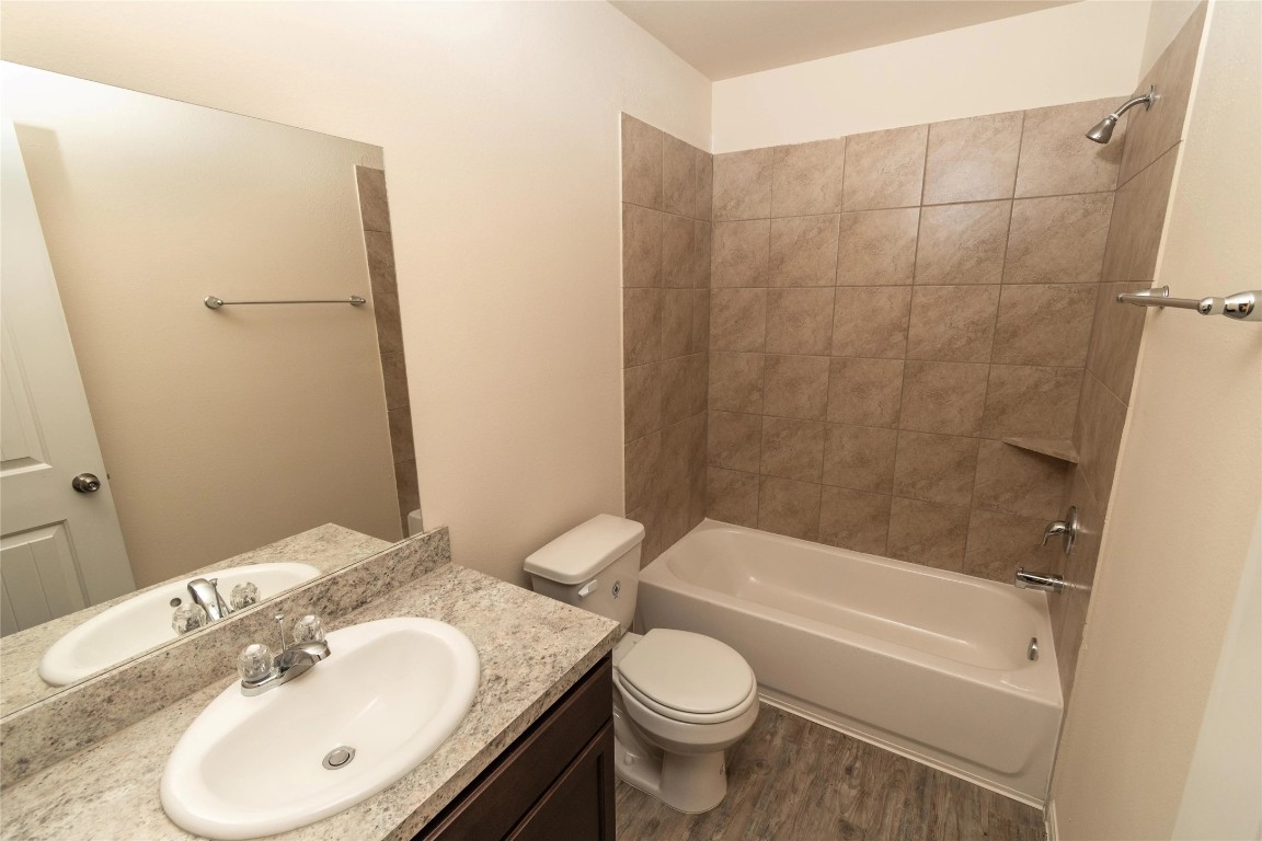 21155 Sprouse Circle Humble, TX 77338 - Photo 8 of 10 a bathroom with a sink toilet and shower