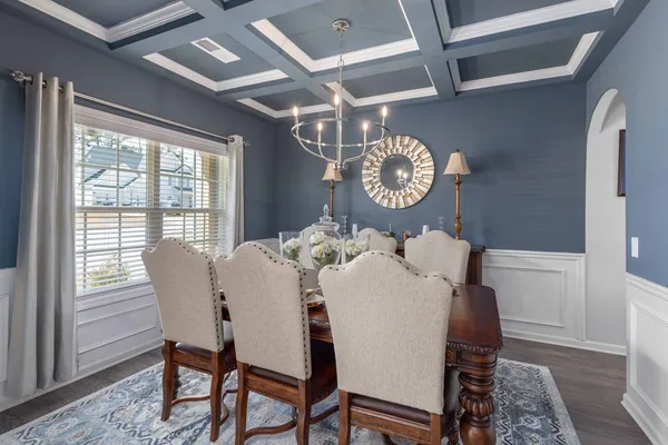 a view of a dining room with furniture and window