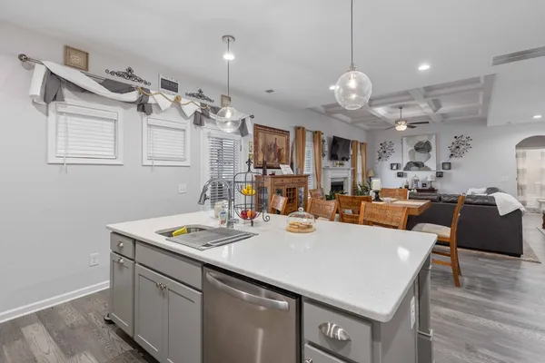 a large kitchen with a table and chairs