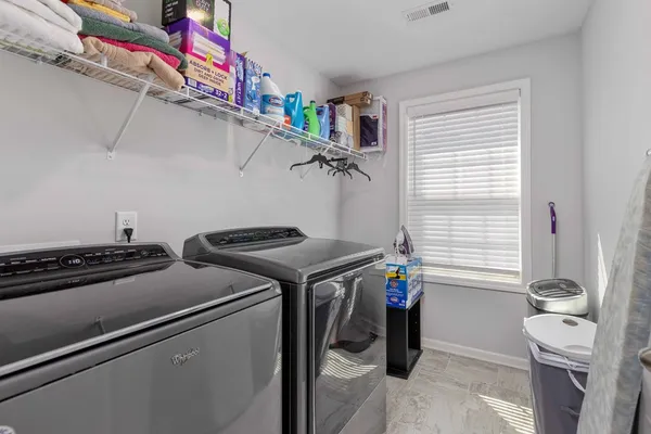 a utility room with dryer and washer