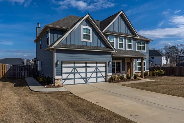 front view of a house with a yard