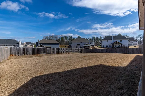 a view of a street with a yard
