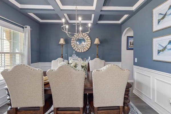 a dining room with furniture and window