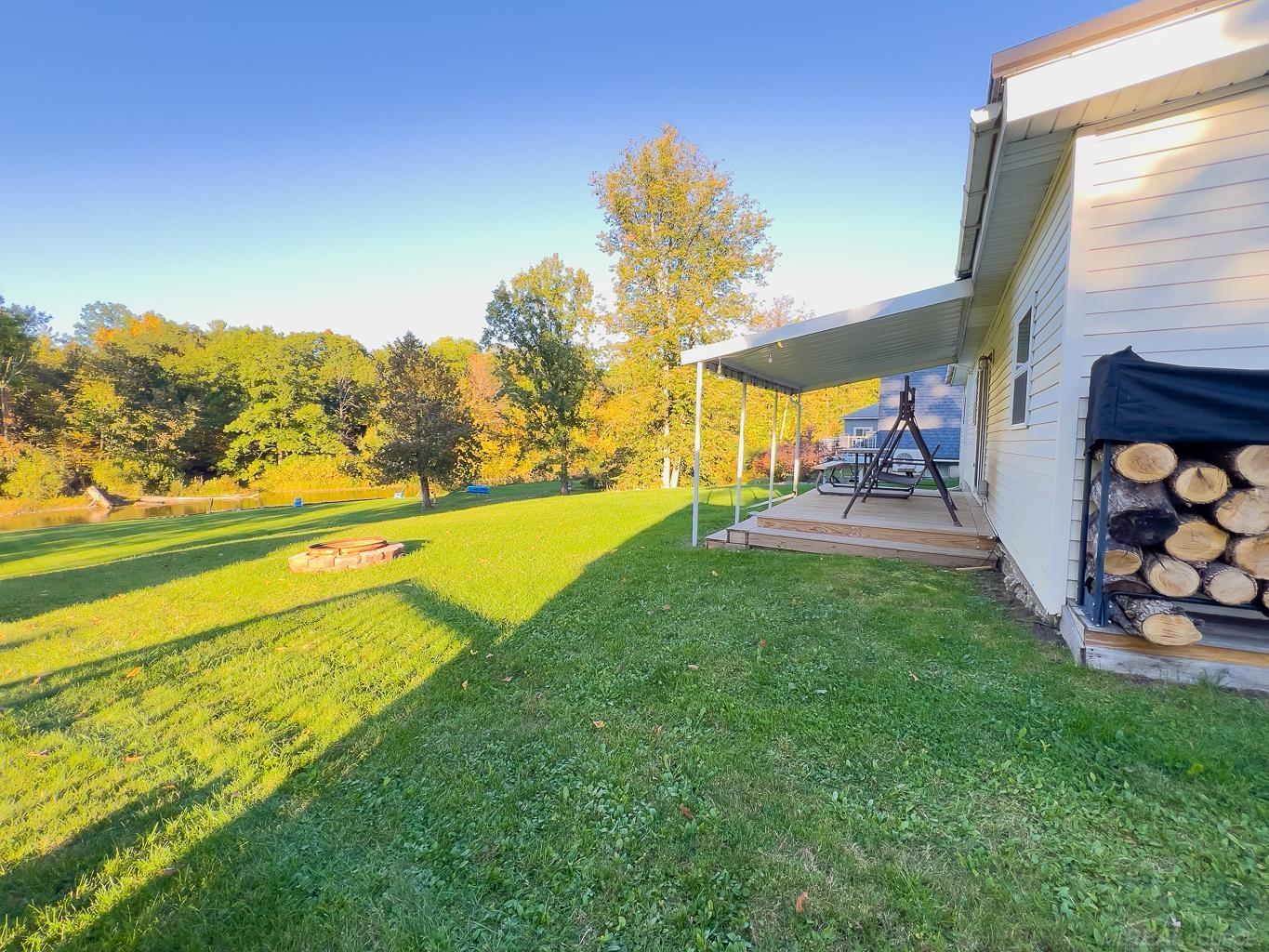 1049 Radov Road Gladwin, MI 48624 - Photo 27 of 40 Take a peek around the corner passed the wood rack.