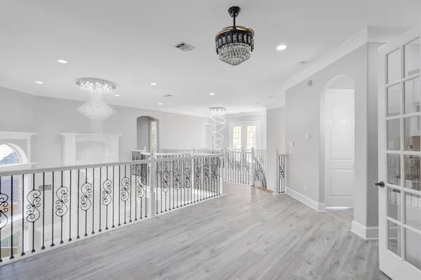 a view of entryway with stairs and wooden floor