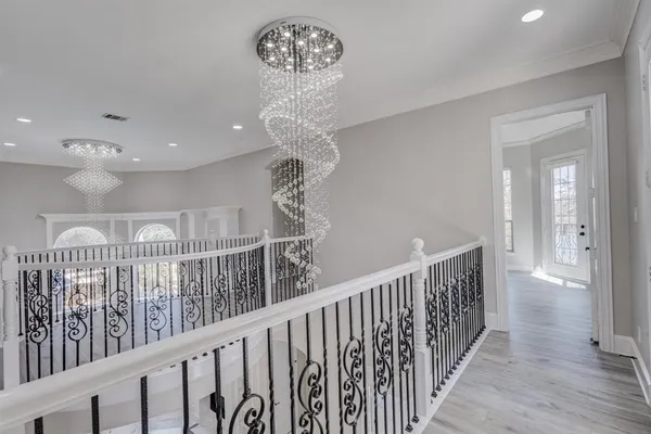 a view of a hallway view with staircase