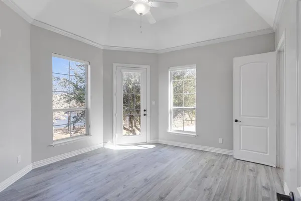 a bathroom with a shower and a glass door