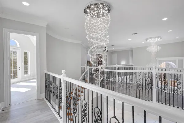 a view of an empty room with a fireplace and a window