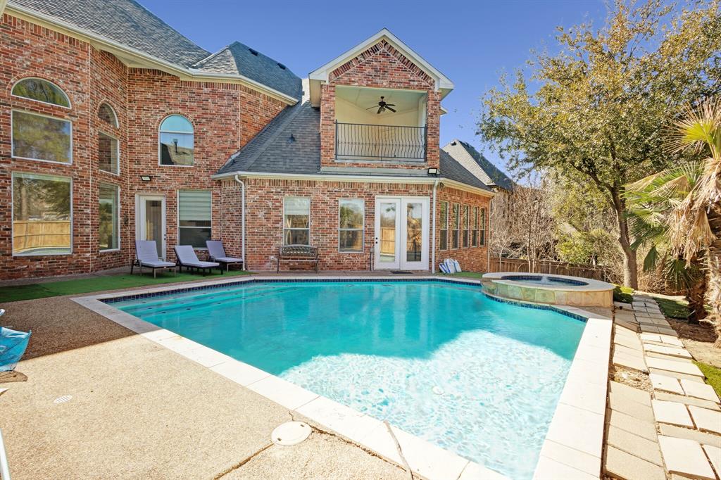 1004 Drake Drive Euless, TX 76039 - Photo 6 of 39 Resort-style pool area with ample seating space and inviting outdoor setting.