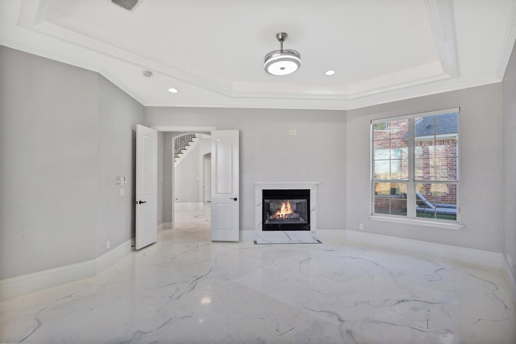 1004 Drake Drive Euless, TX 76039 - Photo 10 of 39 Spacious living room featuring impressive 35-foot ceilings, abundant natural light, and open layout ideal for entertaining.