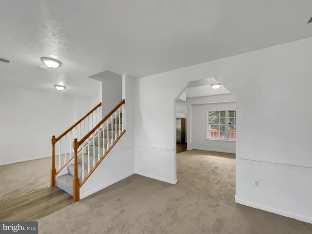 an entryway in a hall with a window