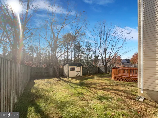 a yellow house with trees in front of it