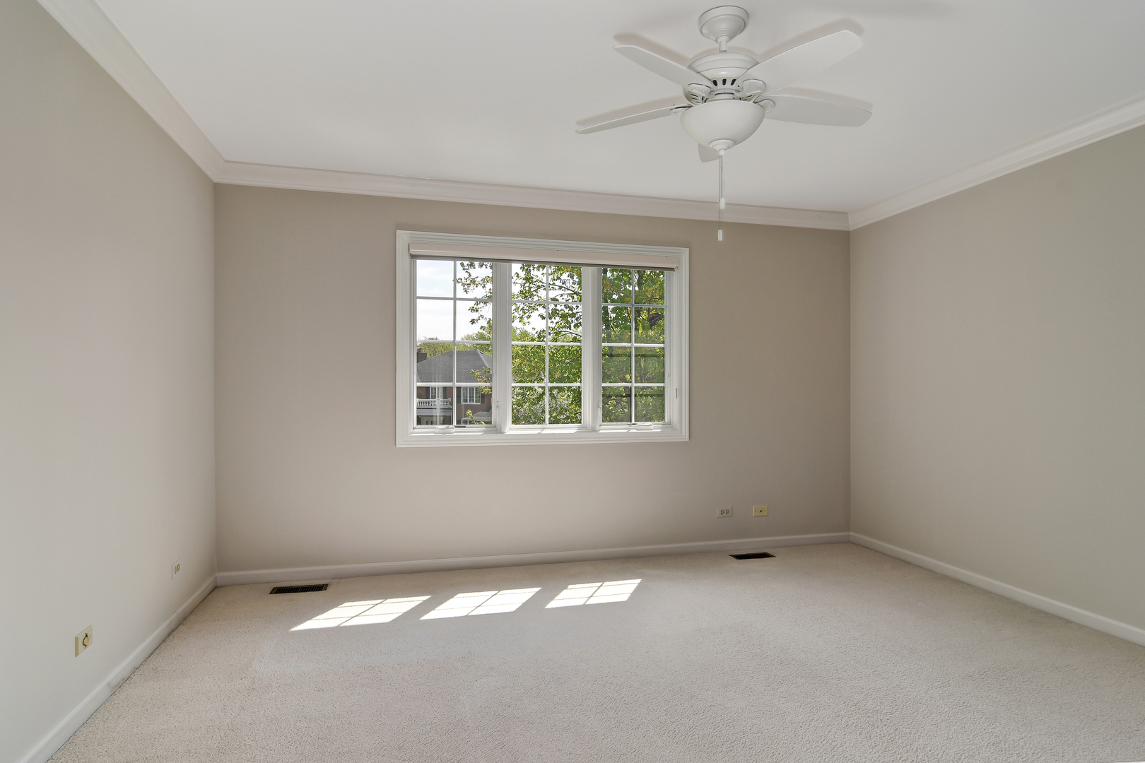 11 Southgate Court Burr Ridge, IL 60527 - Photo 25 of 39 an empty room with a window and a fan