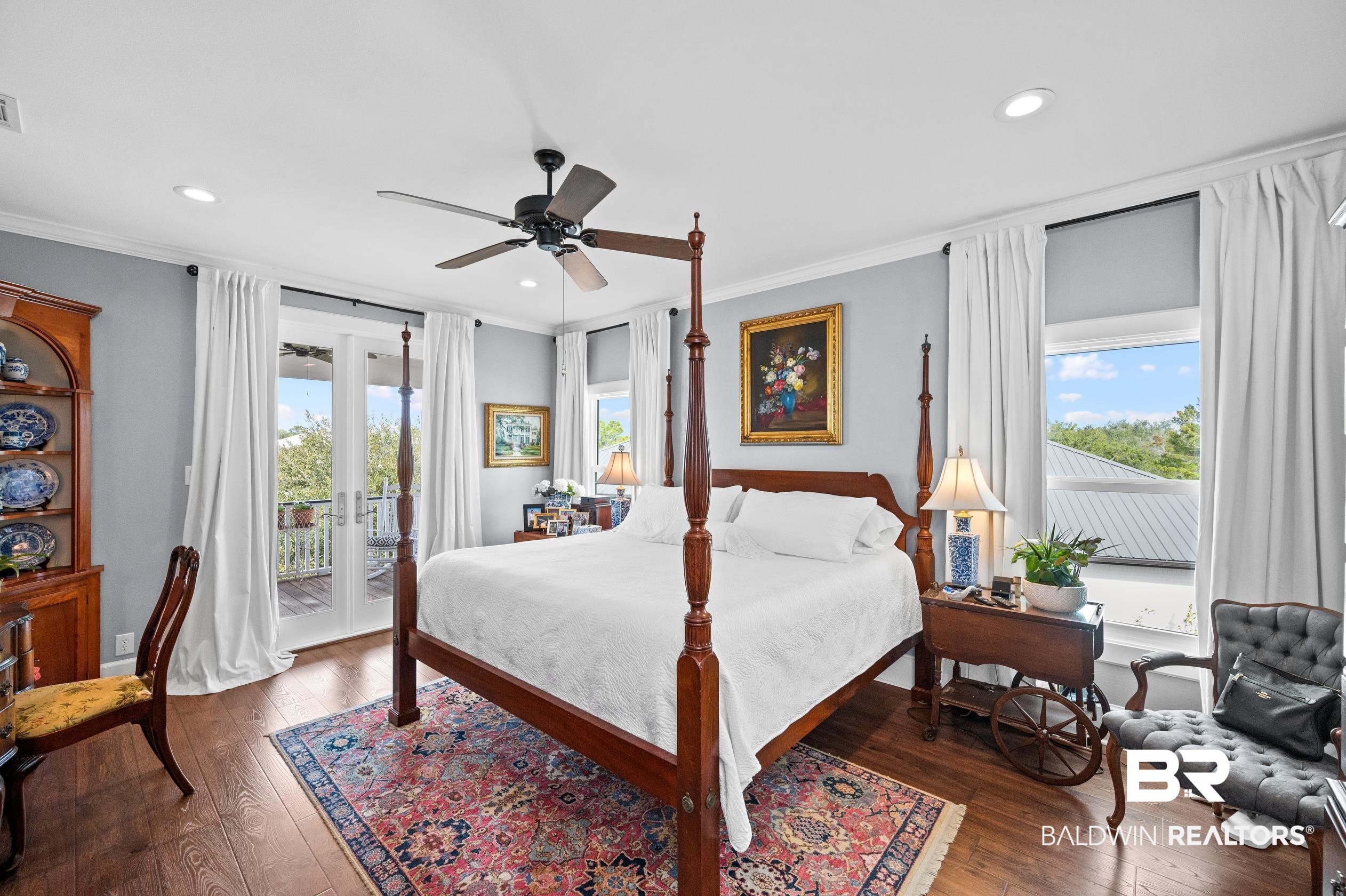 31835 River Road Orange Beach, AL 36561 - Photo 11 of 55 Bedroom with ornamental molding, access to exterior, and multiple windows