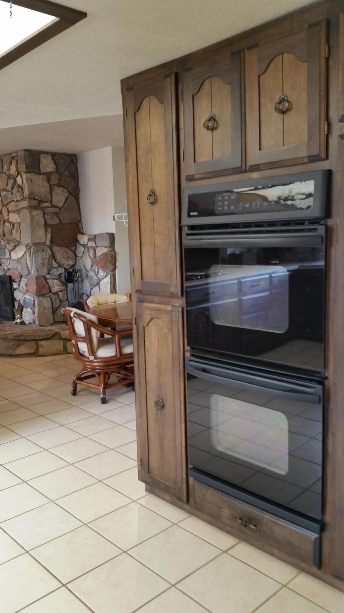 791 West 4th Street South Snowflake, AZ 85937 - Photo 16 of 46 a stove top oven sitting inside of a kitchen