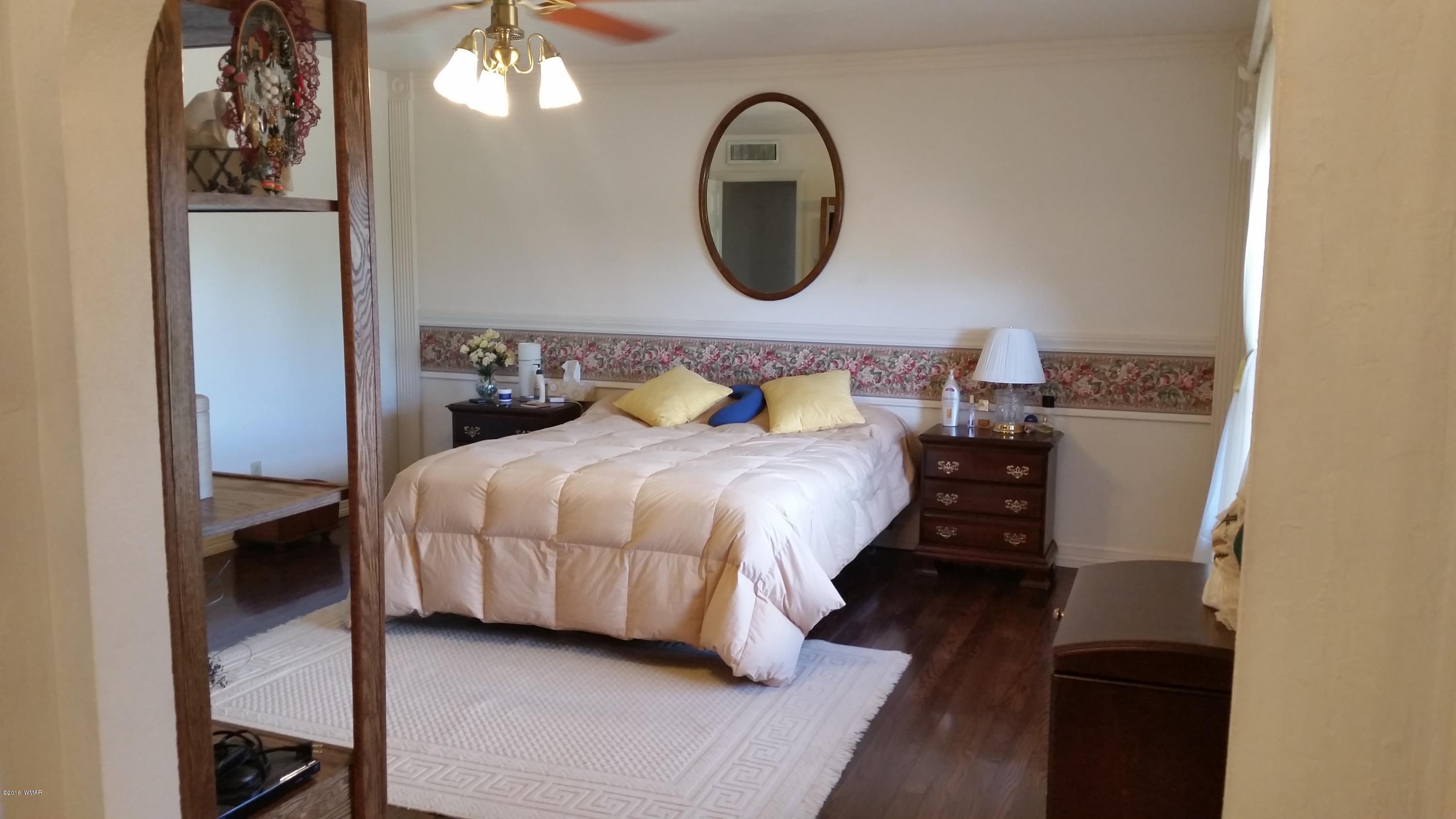 791 West 4th Street South Snowflake, AZ 85937 - Photo 18 of 46 a bedroom with a bed and a mirror