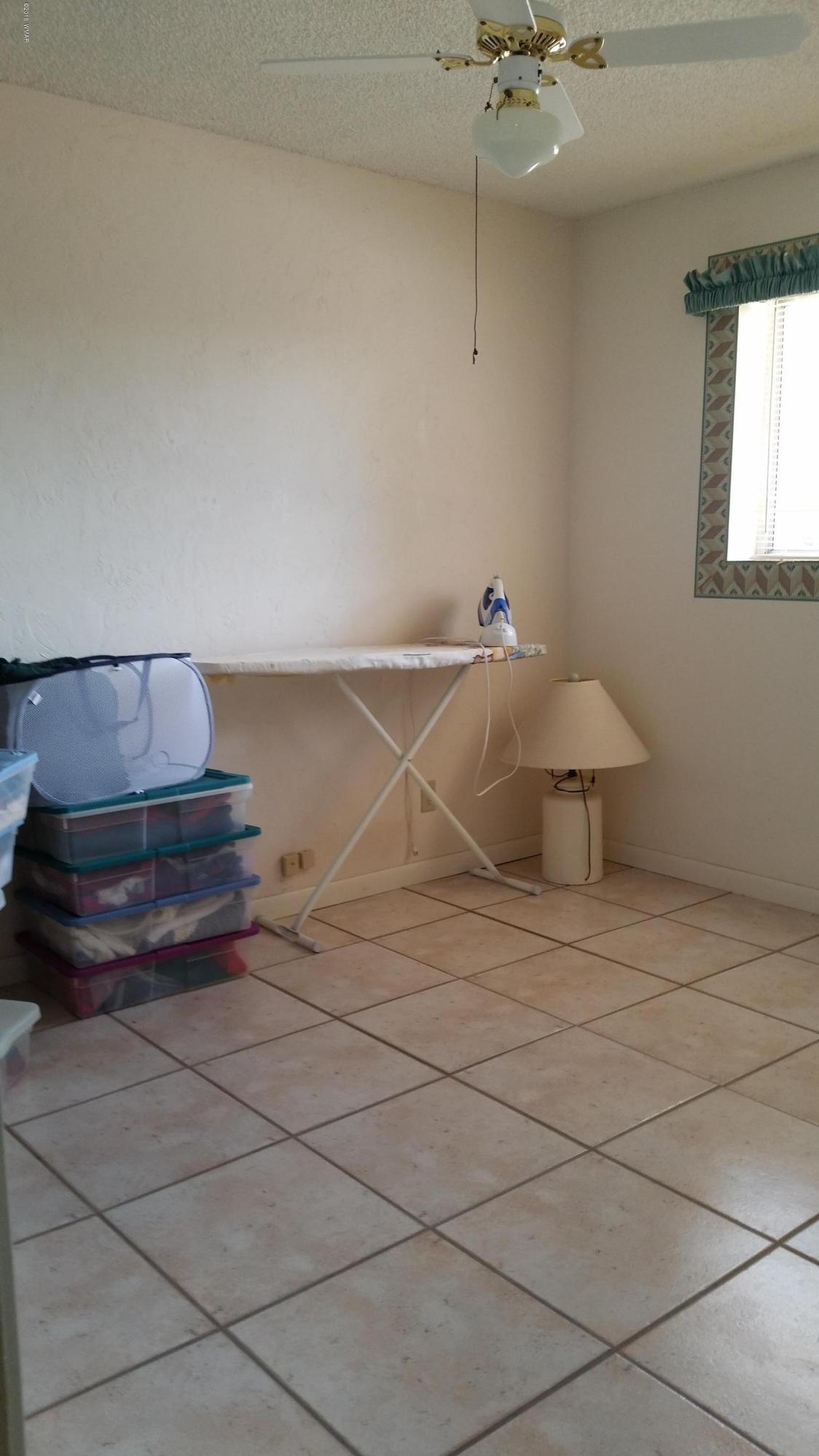 791 West 4th Street South Snowflake, AZ 85937 - Photo 27 of 46 a room with a cabinets and wooden floor