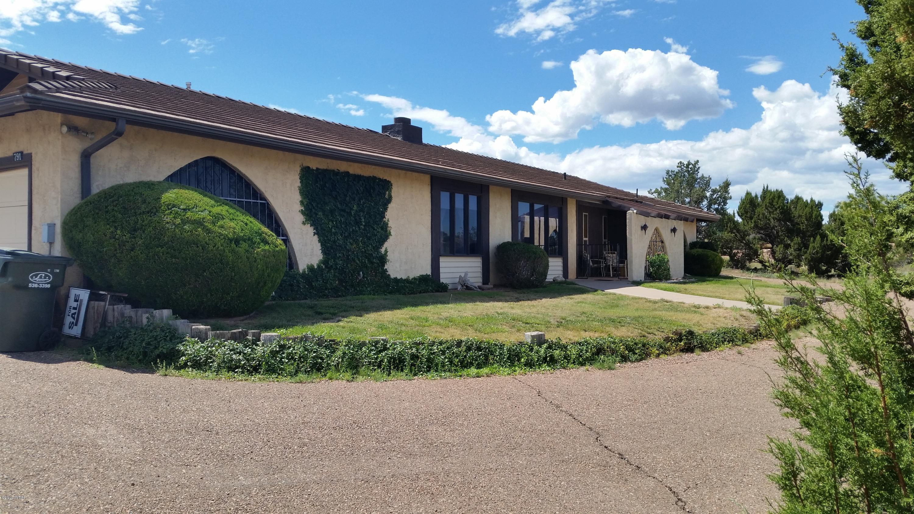 791 West 4th Street South Snowflake, AZ 85937 - Photo 31 of 46 a front view of a house with garden