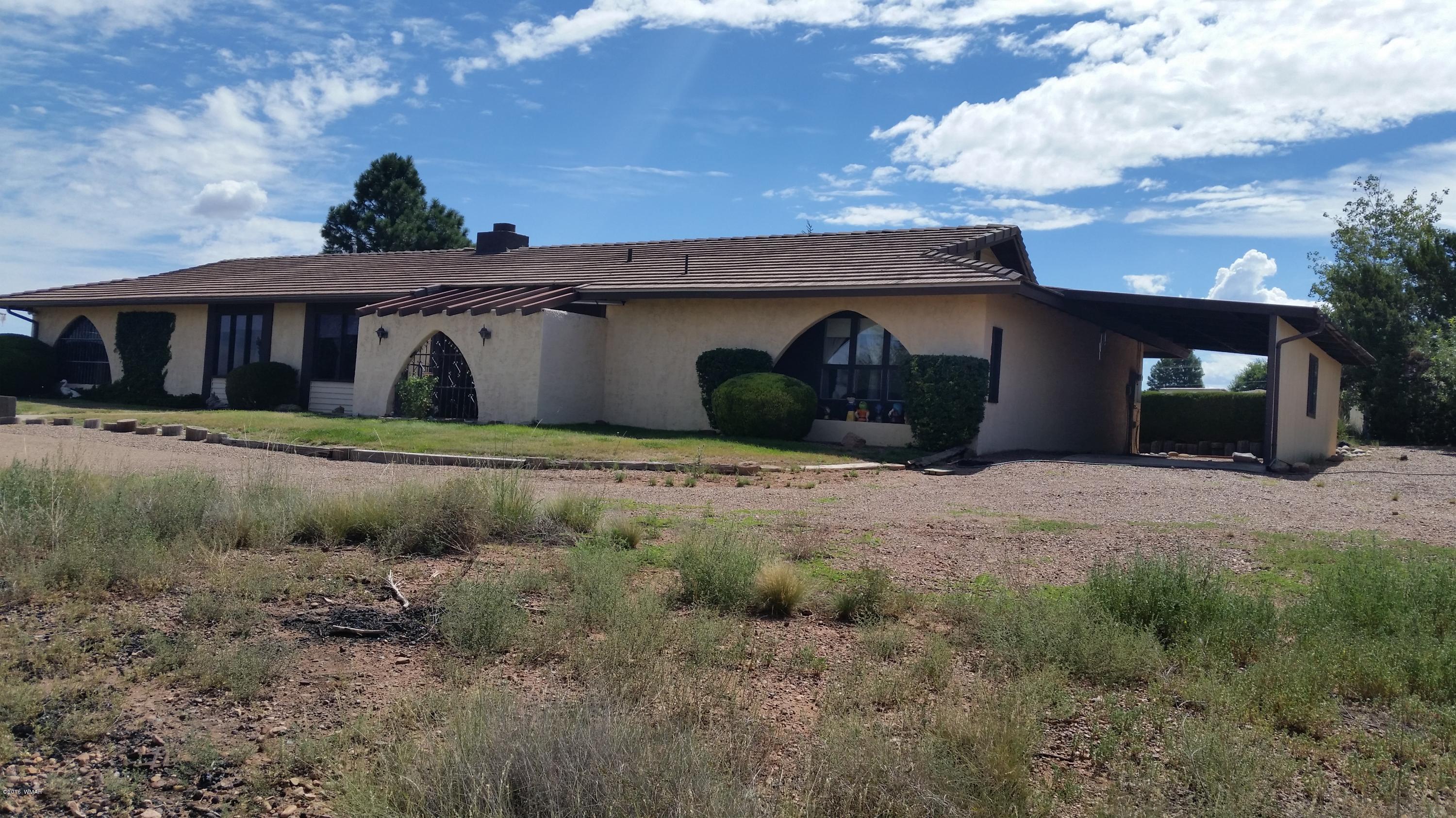 791 West 4th Street South Snowflake, AZ 85937 - Photo 34 of 46 a front view of a house with a yard and garage