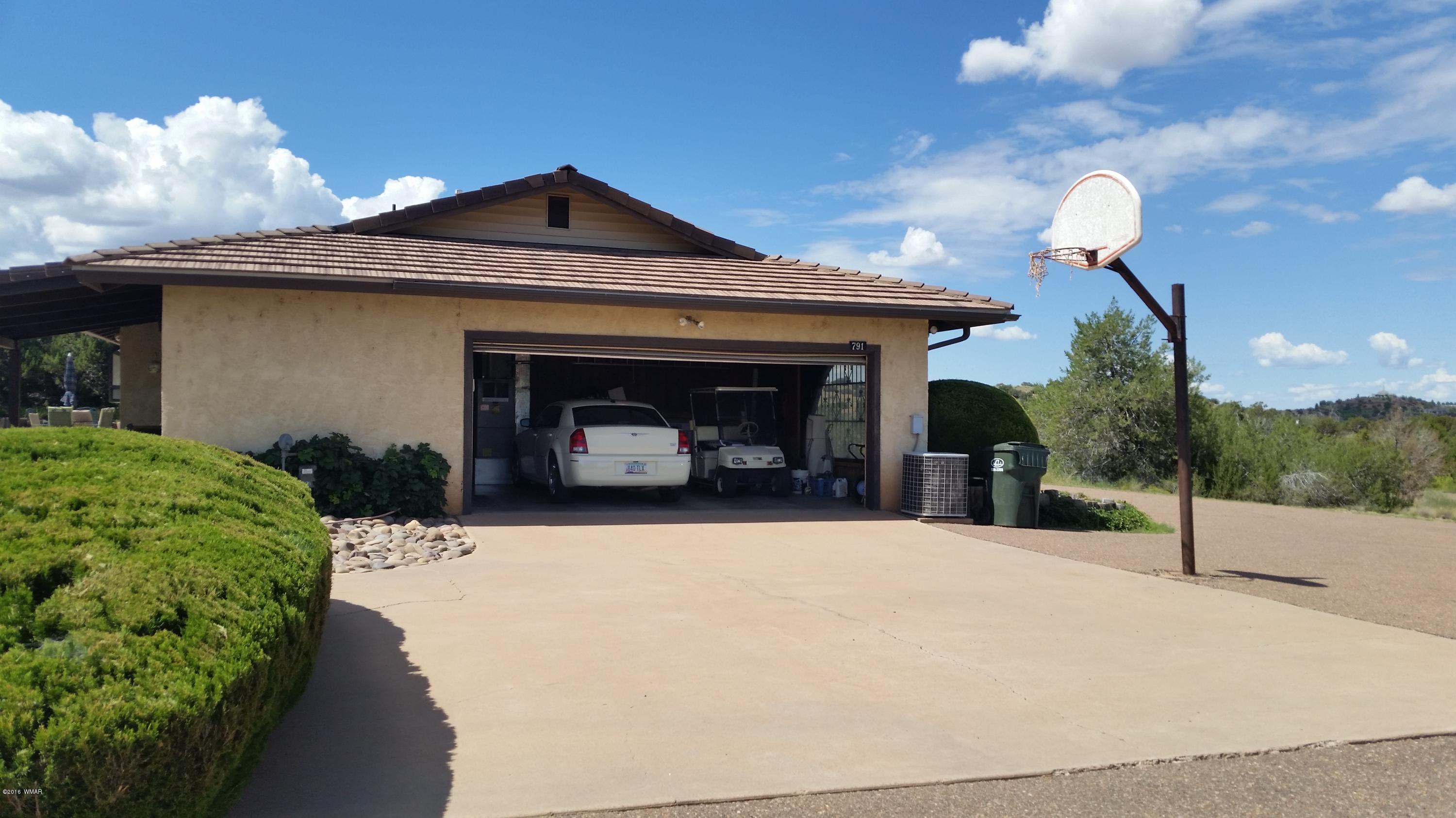 791 West 4th Street South Snowflake, AZ 85937 - Photo 44 of 46 a view of a house with a yard and garage