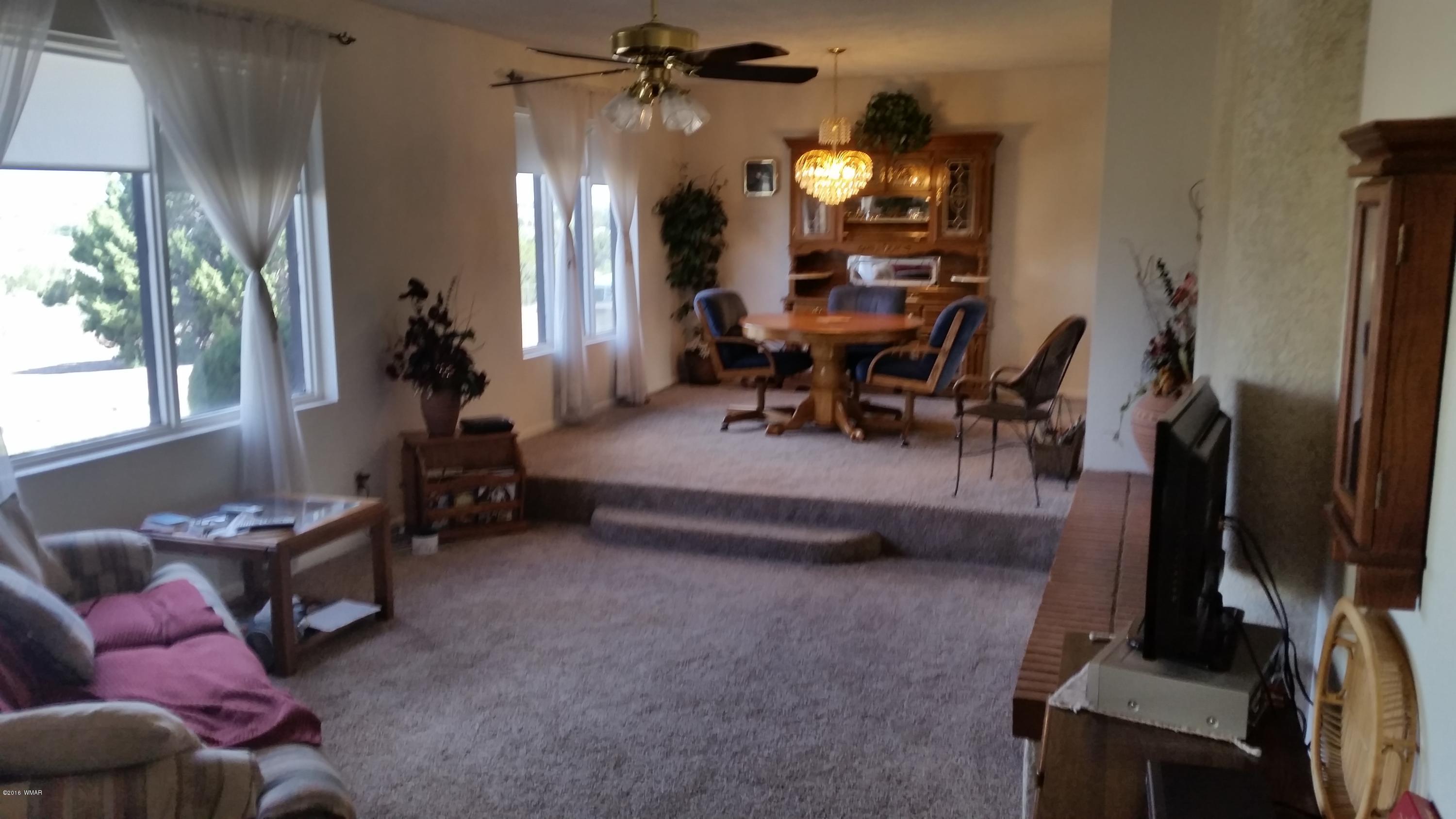 791 West 4th Street South Snowflake, AZ 85937 - Photo 5 of 46 a bedroom with furniture and a flat screen tv