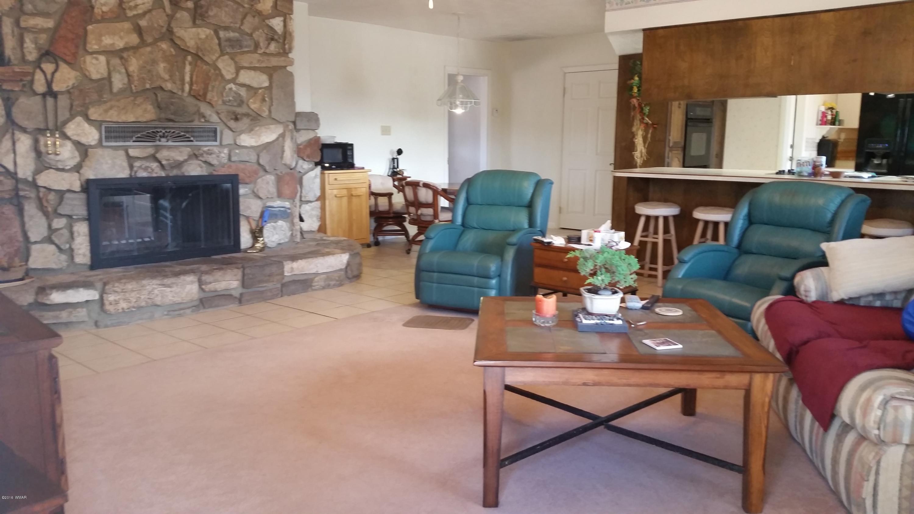 791 West 4th Street South Snowflake, AZ 85937 - Photo 9 of 46 a living room with furniture and a fireplace