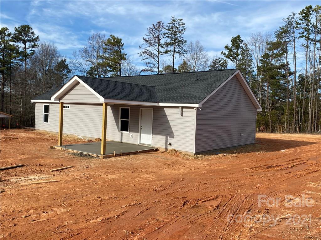 3765-l L L L Davis Road Clover, SC 29710 - Photo 3 of 13 a front view of a house with a yard and garage