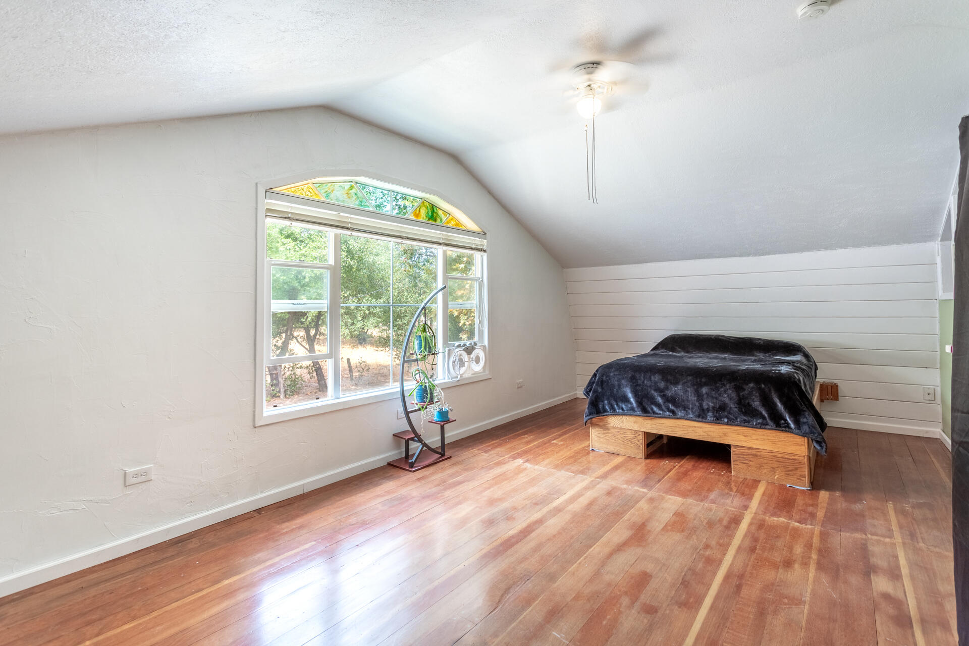 8132 Maynard Road Palo Cedro, CA 96073 - Photo 13 of 35 a bedroom with a bed and a window
