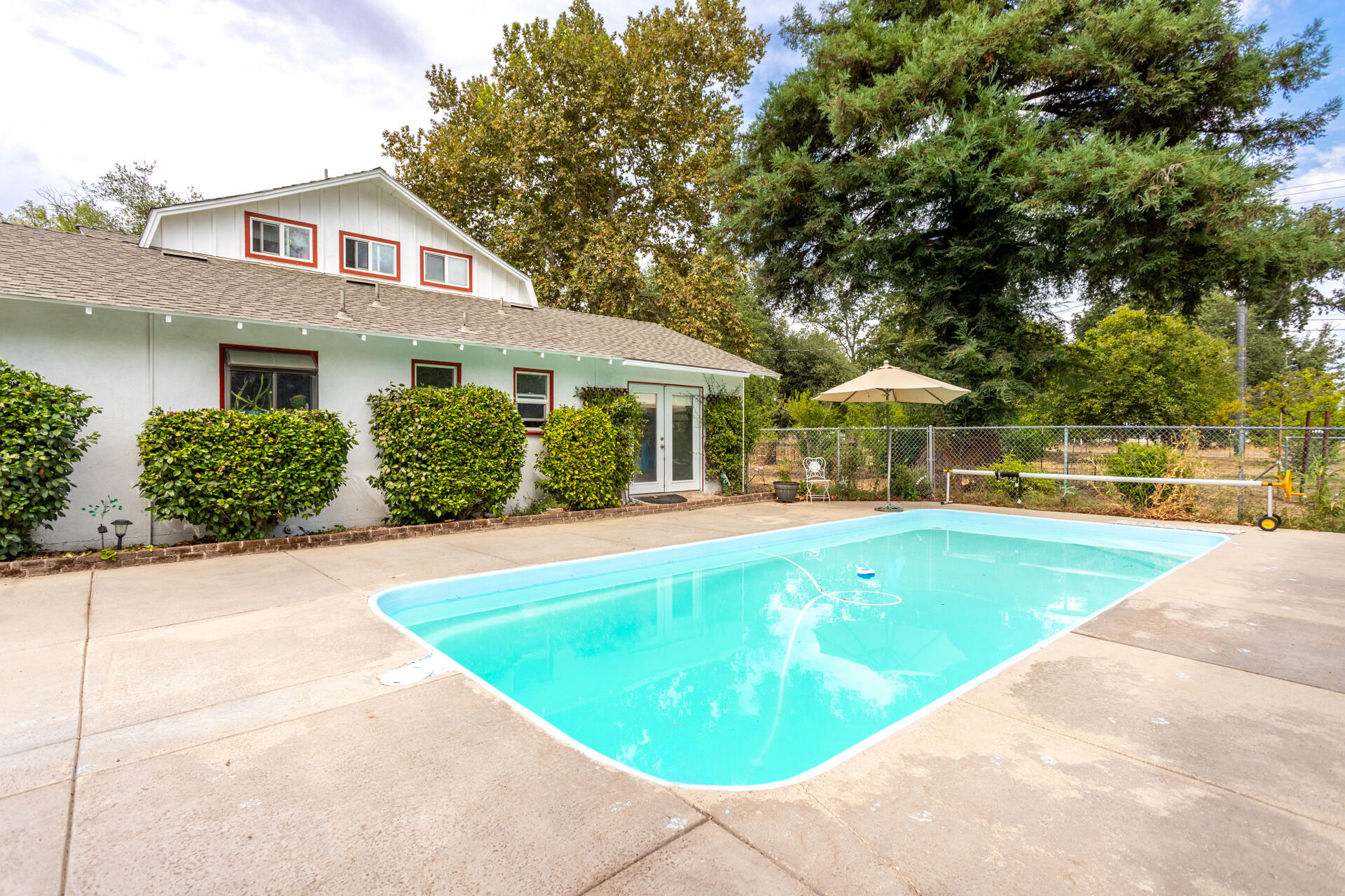 8132 Maynard Road Palo Cedro, CA 96073 - Photo 22 of 35 a front view of a house with a yard