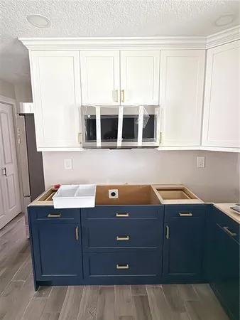 a kitchen with a sink and a stove