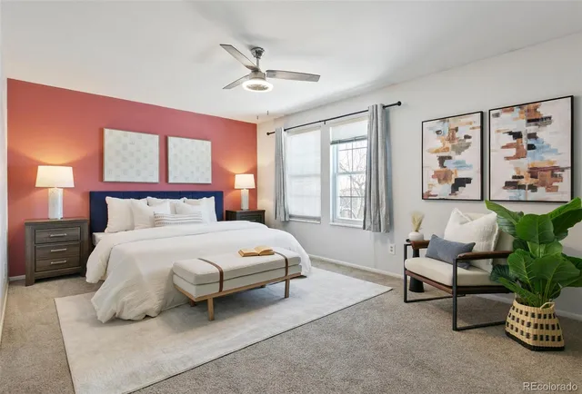 a bedroom with a bed chair and window