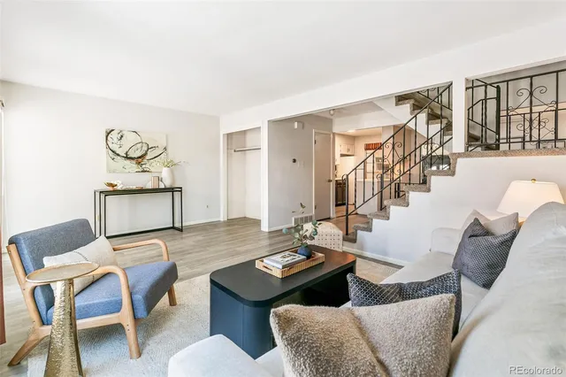 a view of a livingroom with furniture and a table
