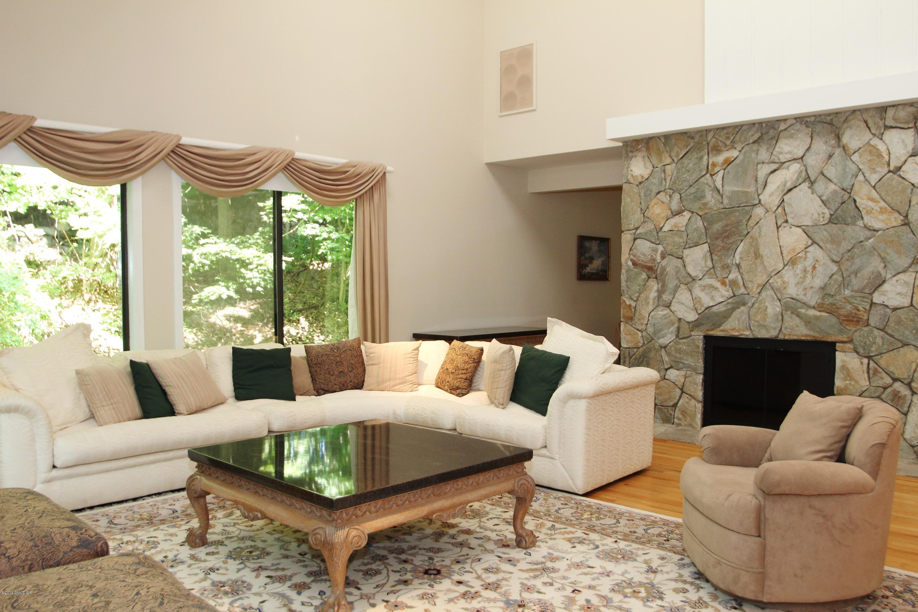 75 Taconic Road Greenwich, CT 06831 - Photo 4 of 21 a living room with furniture and a large window