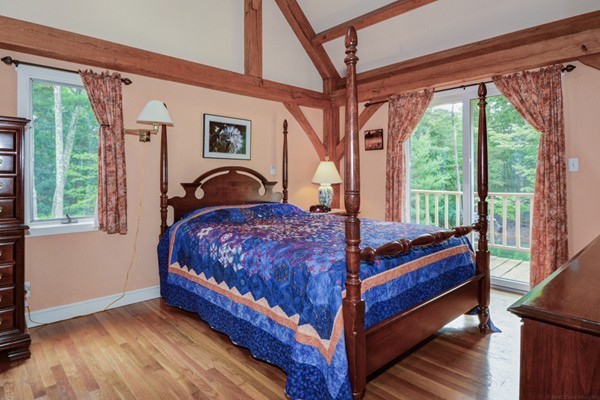 37 Wedgewood Road Stow, MA 01775 - Photo 17 of 30 a bed sitting in a bedroom next to a window