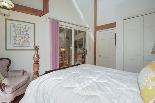 37 Wedgewood Road Stow, MA 01775 - Photo 20 of 30 a bedroom with bed and a couch