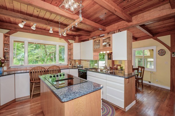 37 Wedgewood Road Stow, MA 01775 - Photo 5 of 30 a kitchen with stainless steel appliances granite countertop sink stove and wooden cabinets