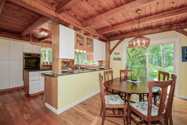 37 Wedgewood Road Stow, MA 01775 - Photo 6 of 30 a dining room with furniture a fireplace and wooden floor