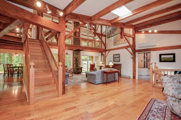 37 Wedgewood Road Stow, MA 01775 - Photo 8 of 30 a living room with furniture and a chandelier