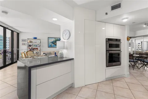 a kitchen with stainless steel appliances granite countertop a sink and cabinets