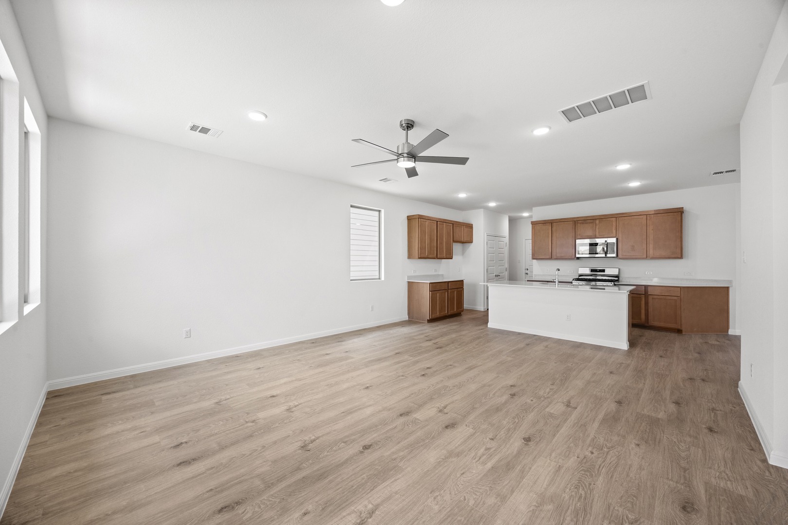 200 Hornet Street Elgin, TX 78621 - Photo 8 of 39 a view of kitchen with wooden floor and window